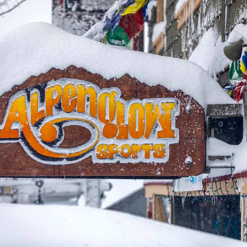 Snow covering the sign and entrance at Alpenglow Sports in Tahoe City, California.