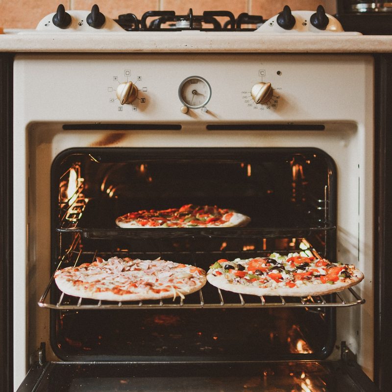 Pizzas on oven racks