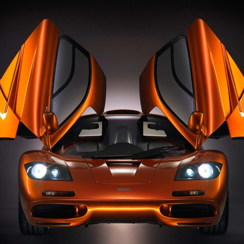 McLaren F1 doors open orange front view