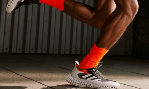 Running in Adidas shoes.