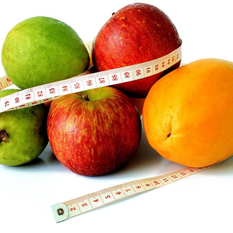 Fruit wrapped in measuring tape
