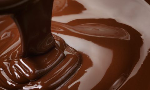 melted dark chocolate flow, candy or chocolate preparation background