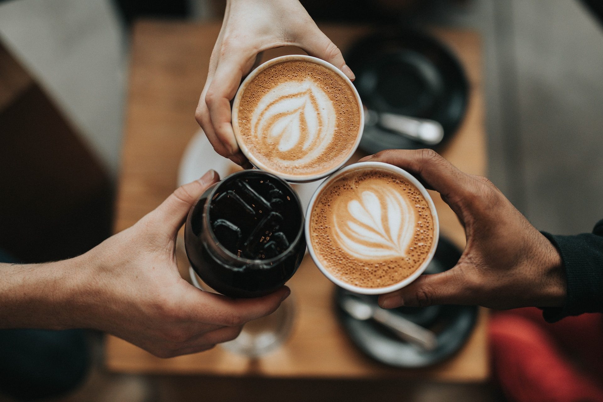 Three coffee cups at a coffee shop