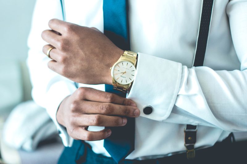Man fixing his cufflink