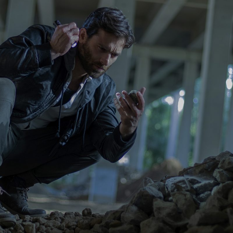 Man kneeling in rubble