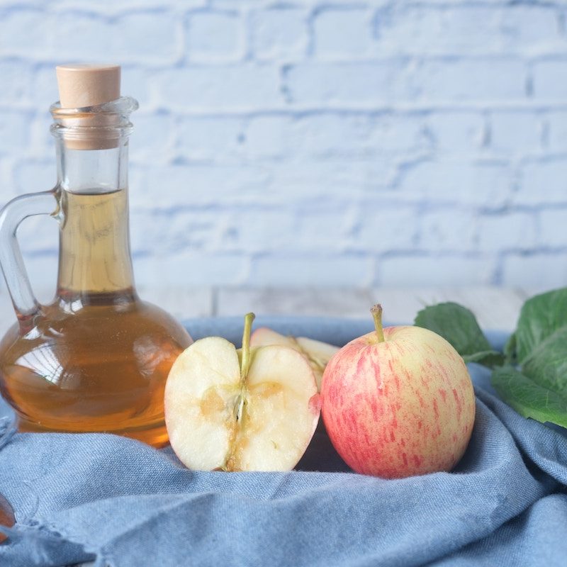 Apple cider vinegar with apples