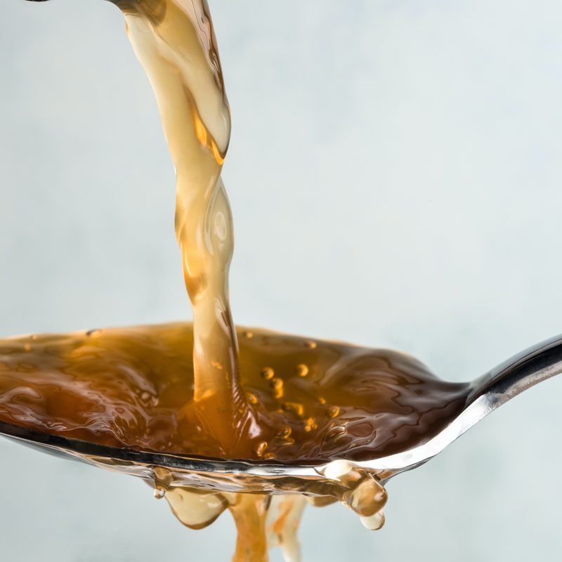 Pouring apple cider vinegar on a spoon