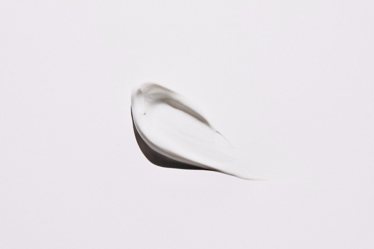 a dollop of body butter against a light backdrop