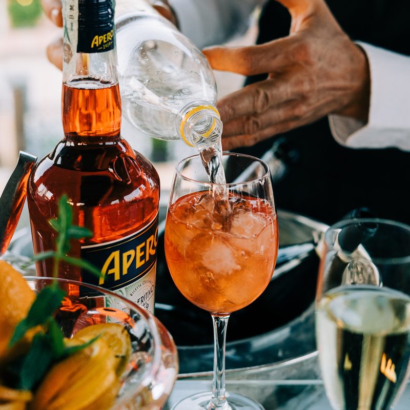 Bartender making an Aperol spritz