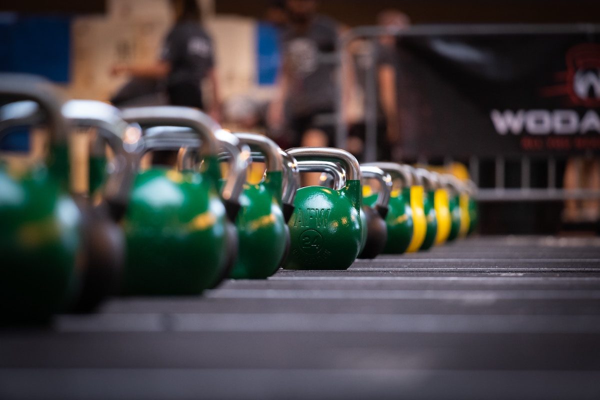 green kettlebells at the gym