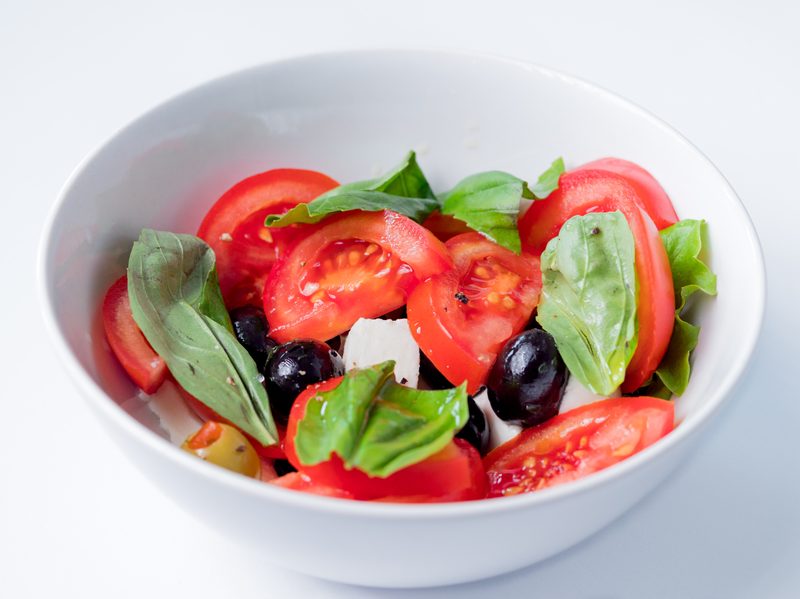 Caprese salad olives tomato basil cheese