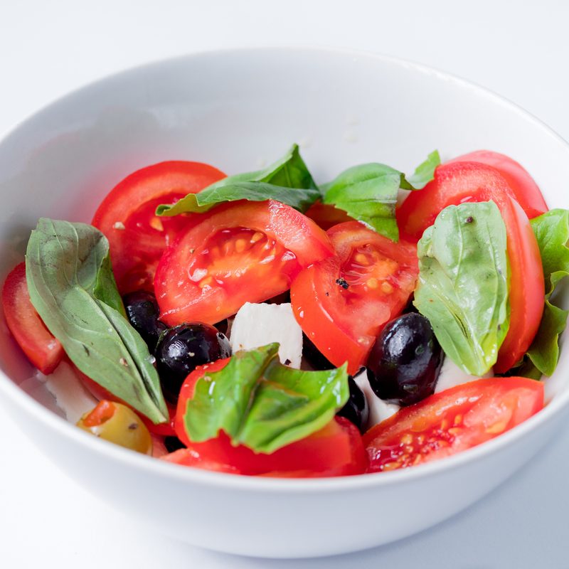 Caprese salad olives tomato basil cheese