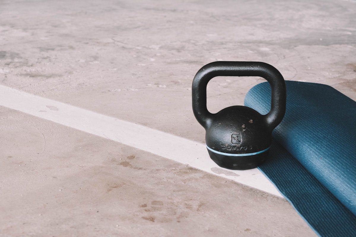 a kettlebell and a yoga mat