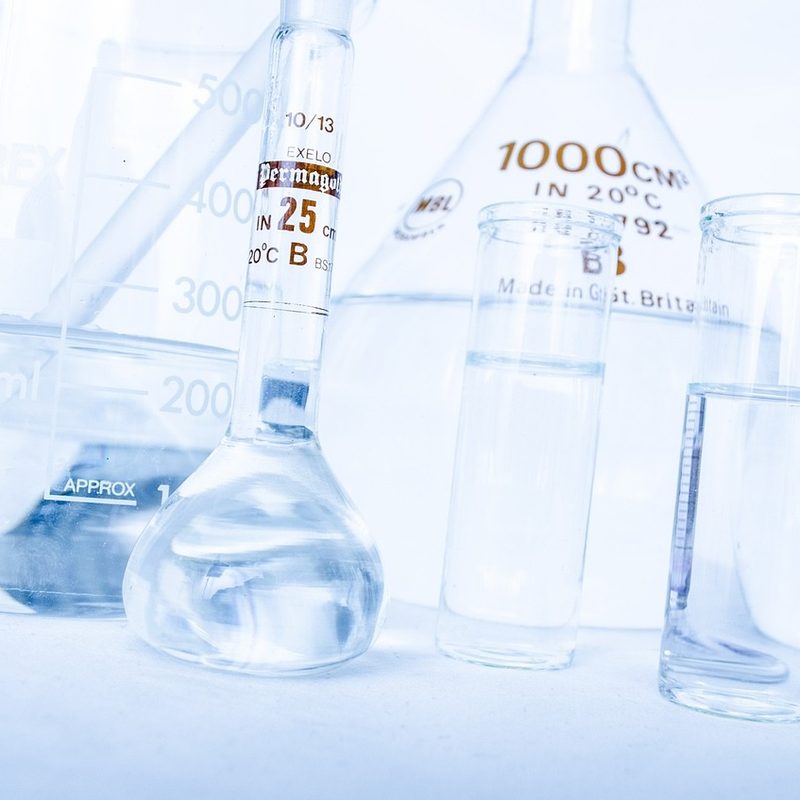 Lab equipment filled with liquid on surface