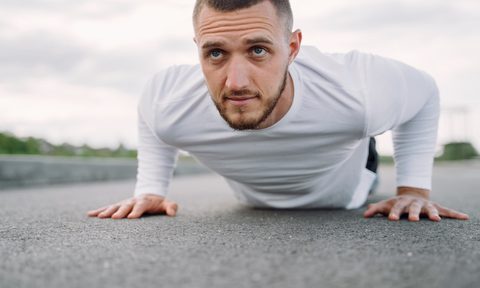 a man doing a core workout on the ground