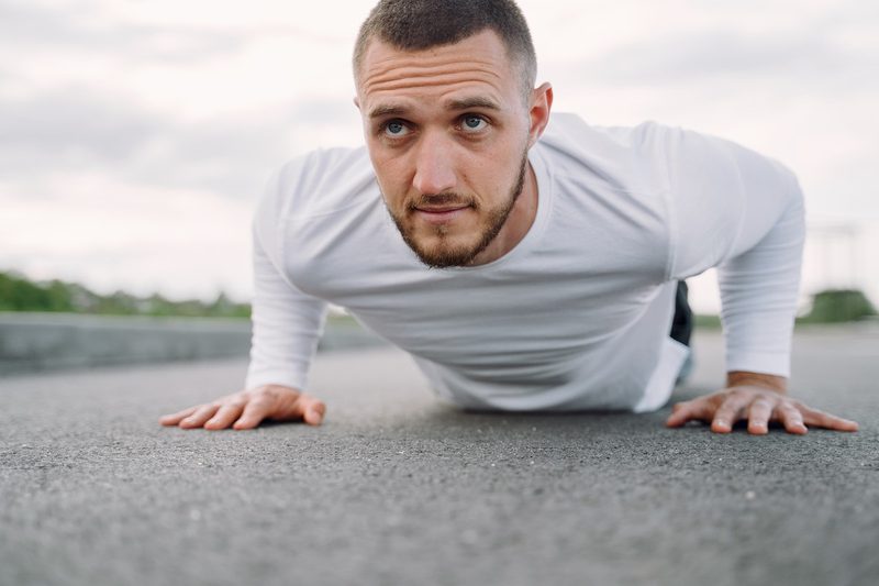 a man doing a core workout on the ground