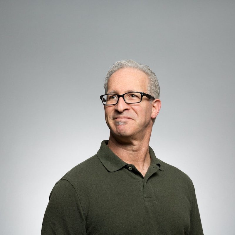 A man with glasses and gray hair