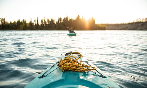 Kayaking on a lake.