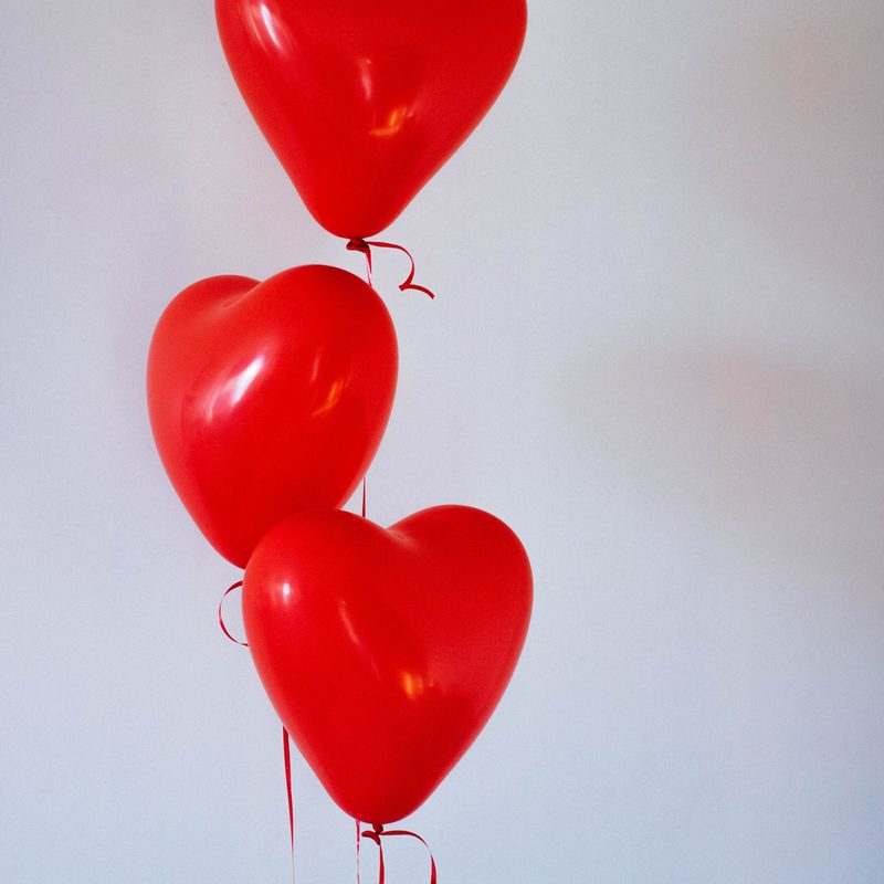 Three heart-shaped balloons