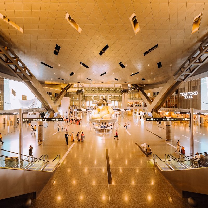Spacious iterior airport terminal where shops are located