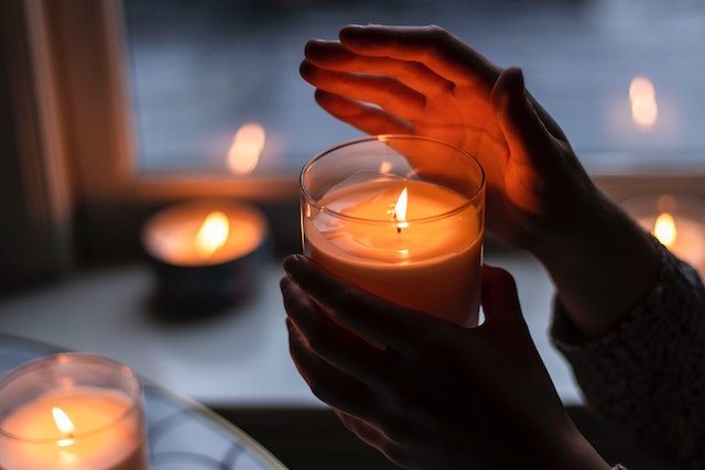 Person holding a candle