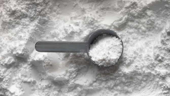 Collagen powder in a measuring spoon