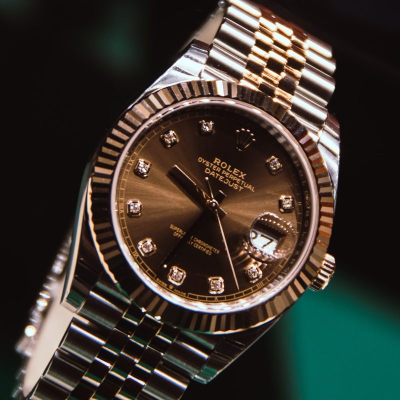 A brown Rolex watch.