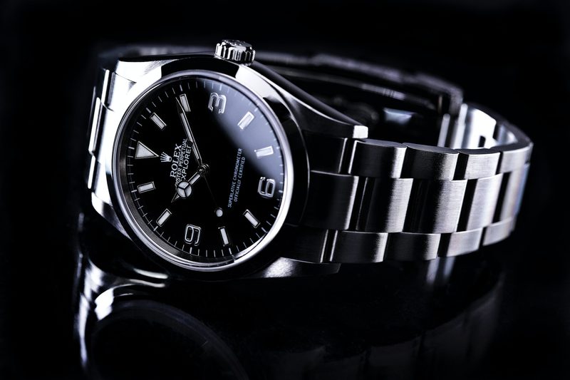 A Rolex watch on its side.