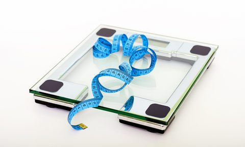 Scale with measuring tape on top