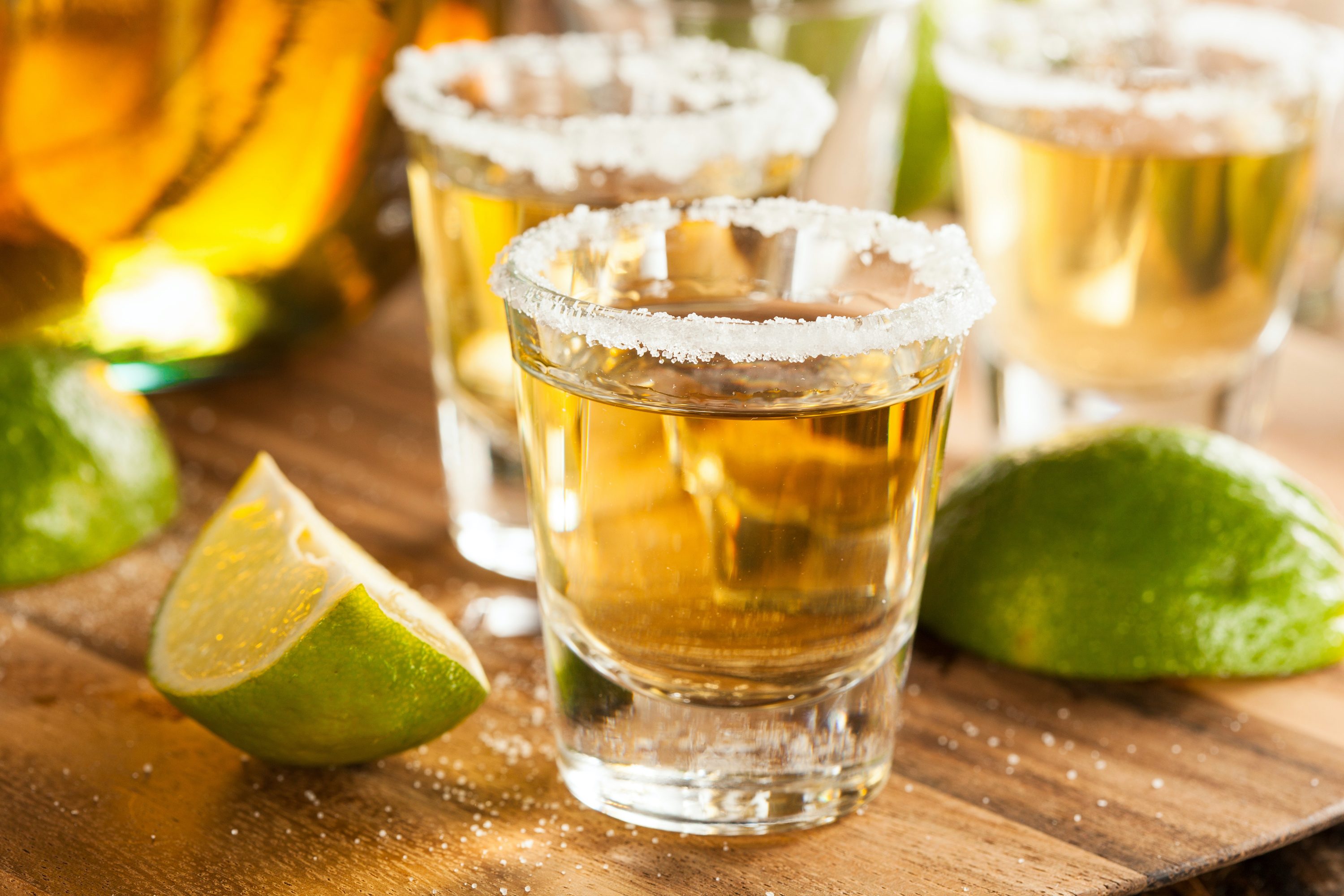 Tequila in shot glasses with lime and salt