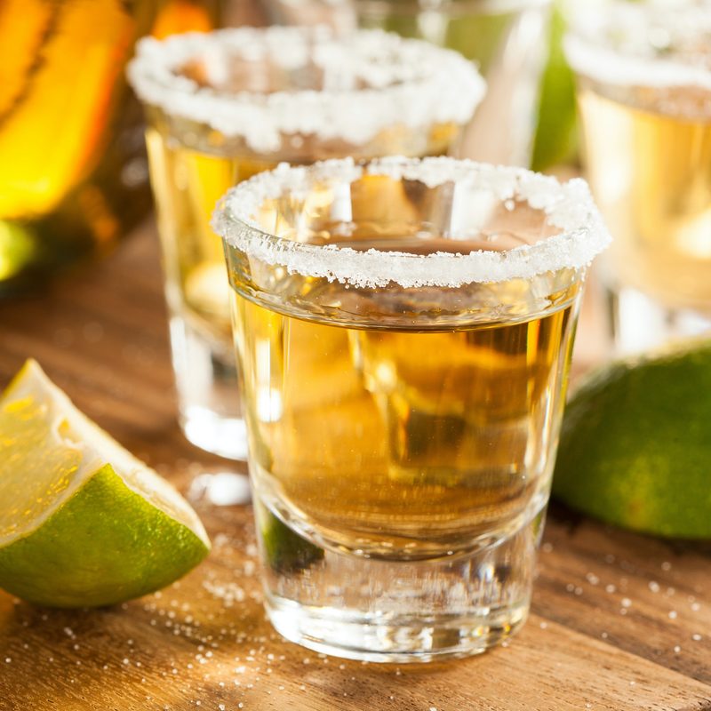 Tequila in shot glasses with lime and salt