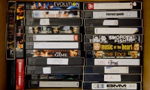a stack of vhs tapes
