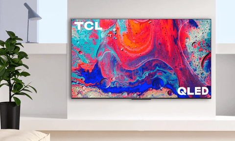 A TCL Q5 TV on a wall.