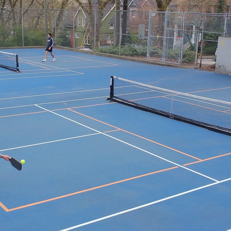 People playing pickleball outside