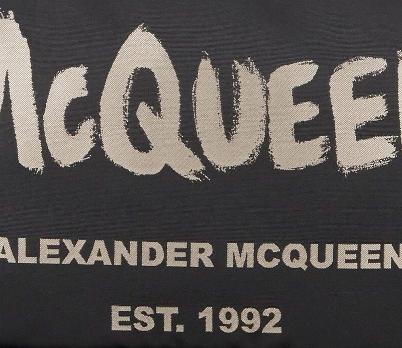 McQueen emblem on Alexander McQueen backpack.
