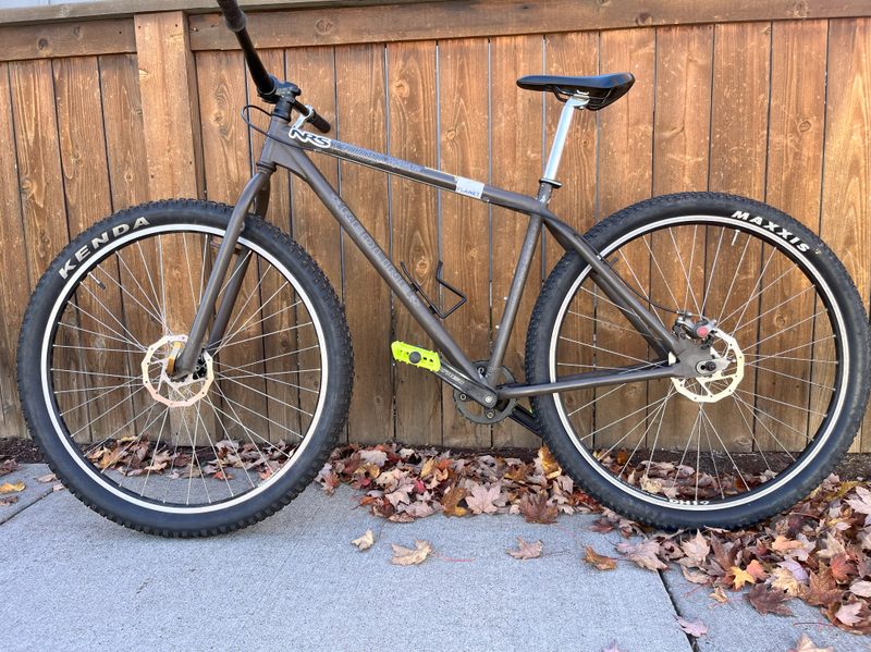 A mountain bike with different tire brands front and rear