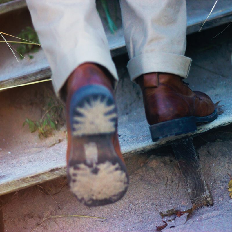 Man on steps in boots