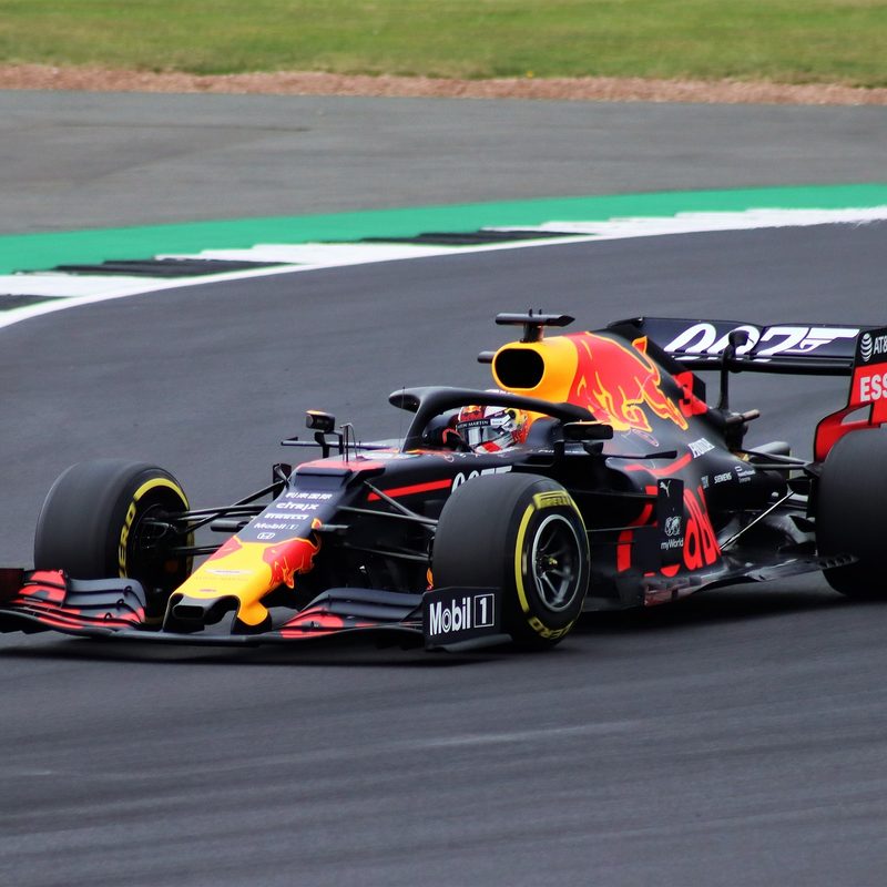 Max Verstappen driving a Red Bull F1 race car.