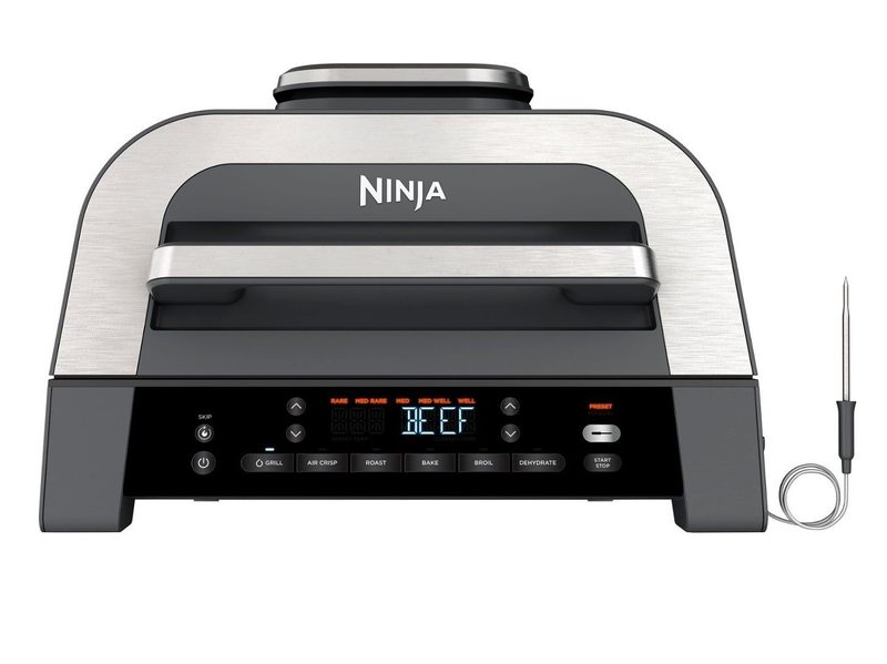 The Ninja Foodi Smart XL 6-in-1 Countertop Indoor Grill with its thermometer at the side.