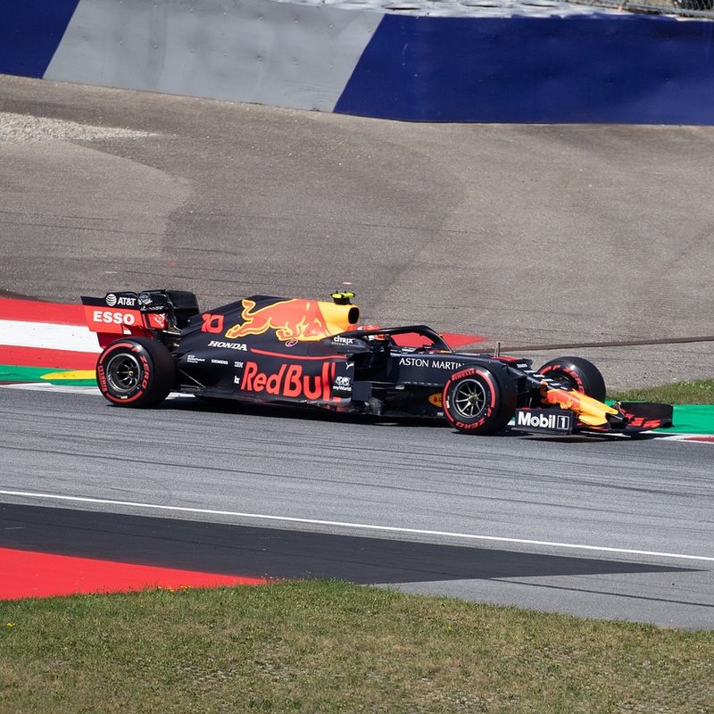 Red Bull team F1 racecar pushing for driver and team championship points.