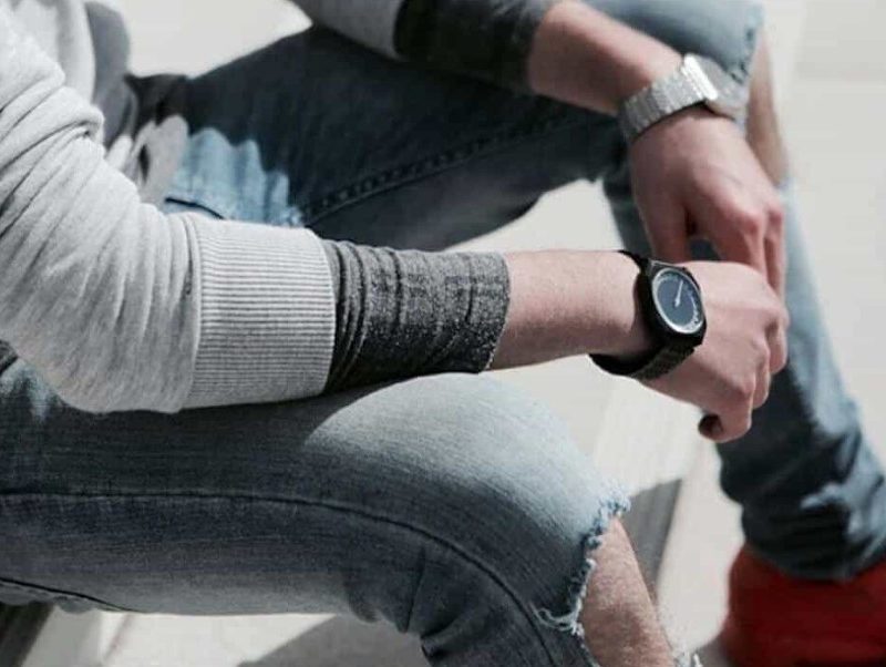 Slow watch on man's wrist