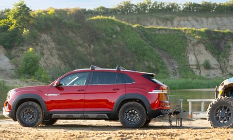 You can toughen up the appearance of a Volkswagen Atlas Sport SUV with the new Basecamp line of styling accessories, shown here about to tow an ATV.