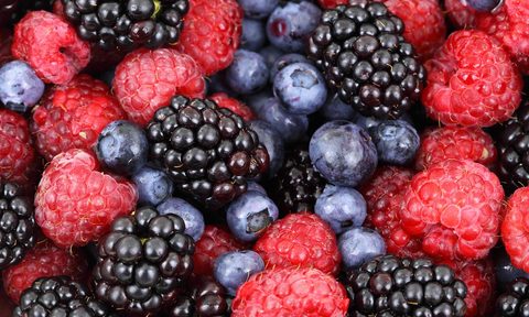 Blackberries, blueberries, and strawberries in the same container