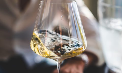 White wine in glass swirling