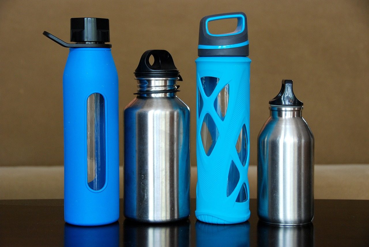 Four reusable water bottles of various shapes and sizes