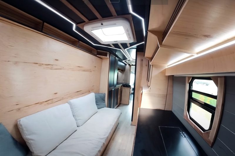 Living/sleeping quarters of YouTuber DualEx's custom Mercedes Sprinter campervan.