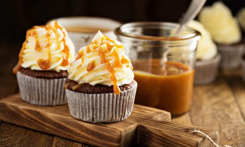 Homemade butterscotch cupcakes with caramel syrup and cream cheese frosting