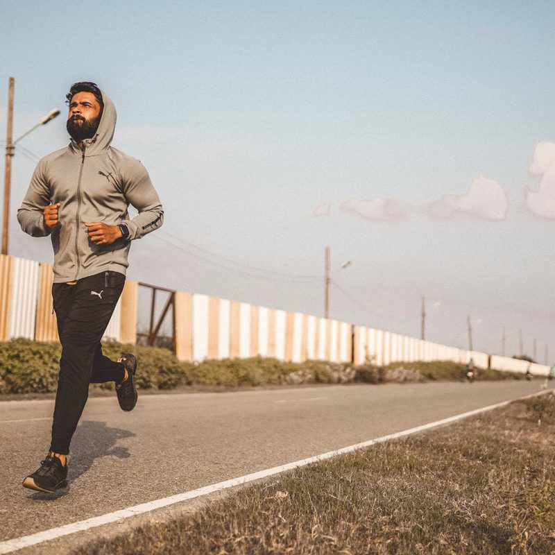Man jogging on pavement