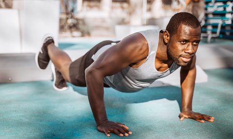 Man doing plank outside