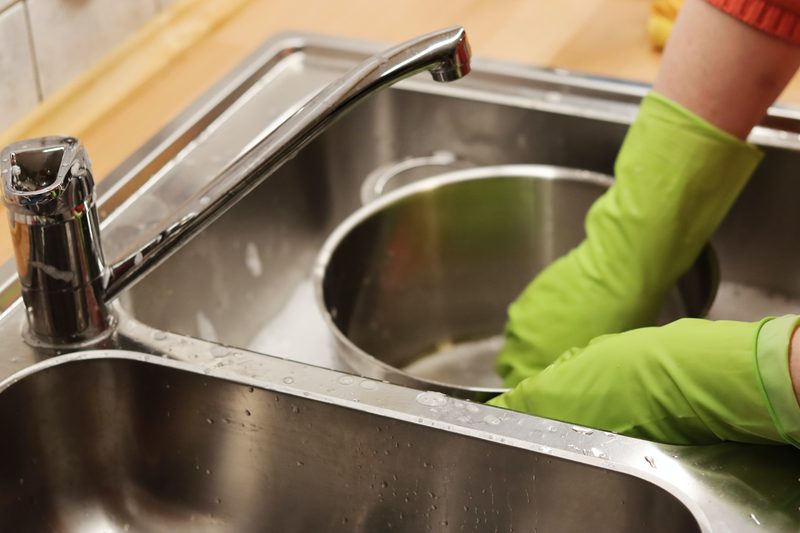 Person washing dishes